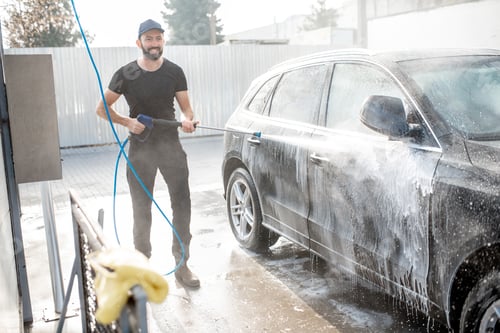 Preview: Man washing car with water gun