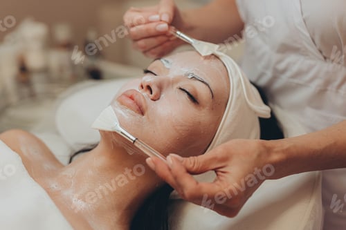 Preview: woman at the cosmetologist. She has problem skin and acne.