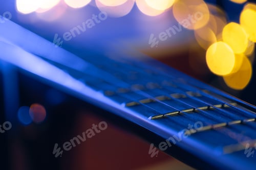 Preview: Part of an acoustic guitar, guitar fretboard on a black background.