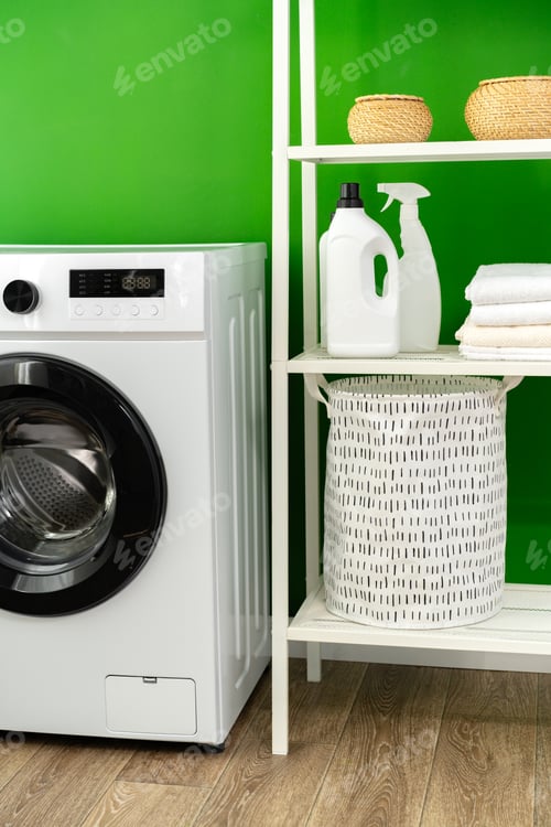 Preview: Modern white washing machine in a laundry room