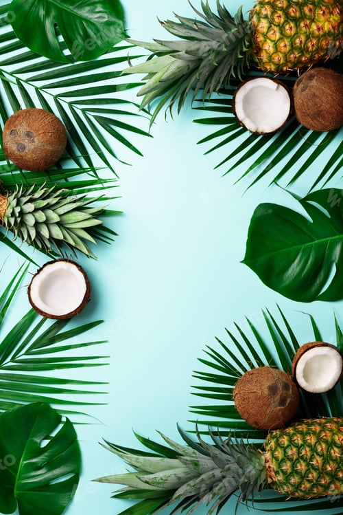 Preview: Exotic pineapples, ripe coconuts, tropical palm and green monstera leaves on blue background with