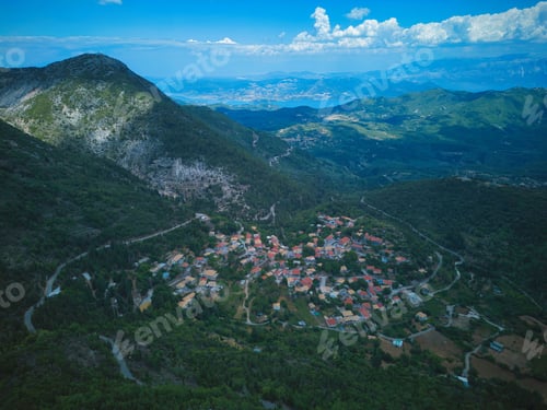 Preview: Aerial view of Eglouvi village in the mountains of Lefkada under the blue sky