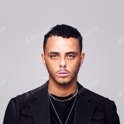 Preview: Studio Portrait Of Young Man With Skin Pigmentation Disorder Looking At Camera
