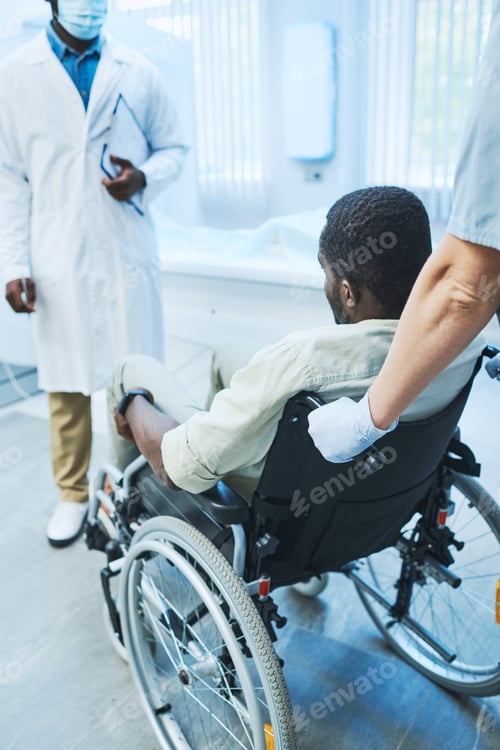 Preview: Black patient in wheelchair visiting MRI