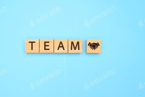 Preview: Teamwork text on wooden cube with abstract blue background