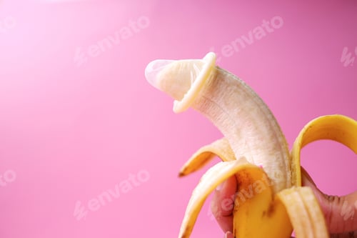 Preview: White Condom on Yellow Banana