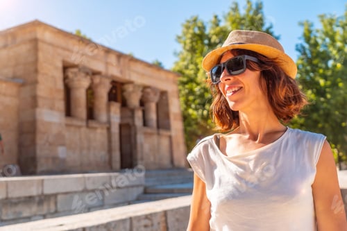 Preview: Temple of Debod in Madrid city of Egypt, young tourist woman with hat in sunset light