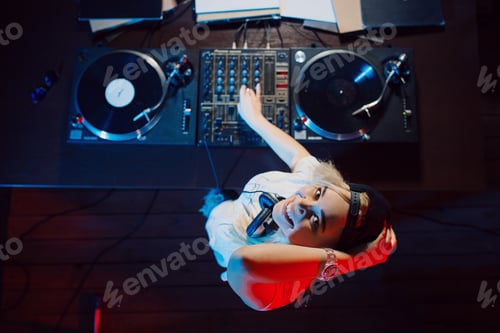Preview: Cute dj woman having fun playing music at club party