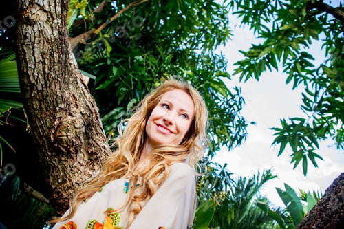 Preview: Low angle view of woman in garden
