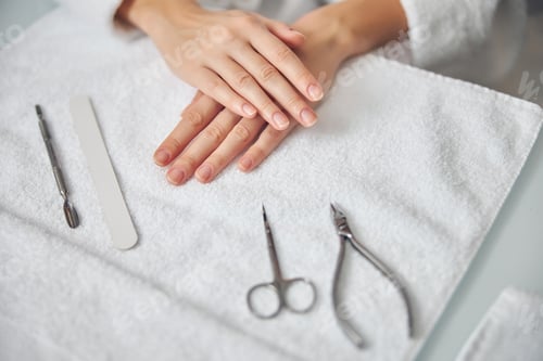 Preview: Woman getting ready for nail service in beauty salon