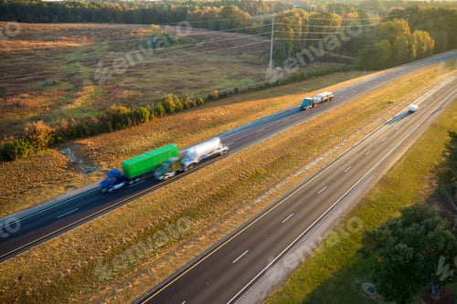 Preview: Aerial view of busy american freeway with fast moving cars and trucks.