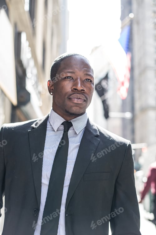Preview: Confident businessman walking