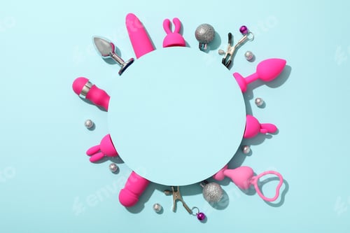 Preview: Sex toy with New Year's decor on a blue background.