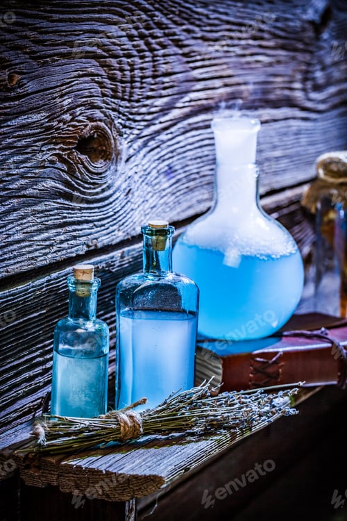 Preview: Closeup of magical blue potions on wooden shelf for Halloween