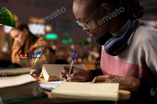 Preview: African american pupil collecting notes and citations from reliable sources
