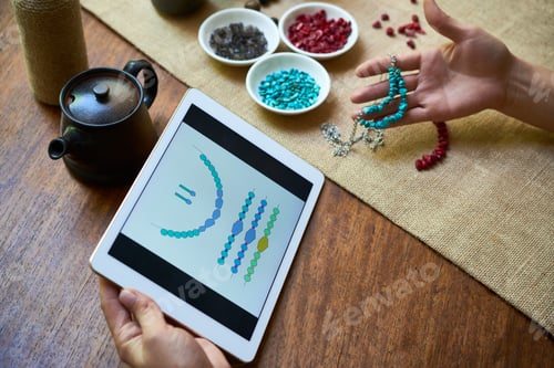 Preview: Woman making stone necklace