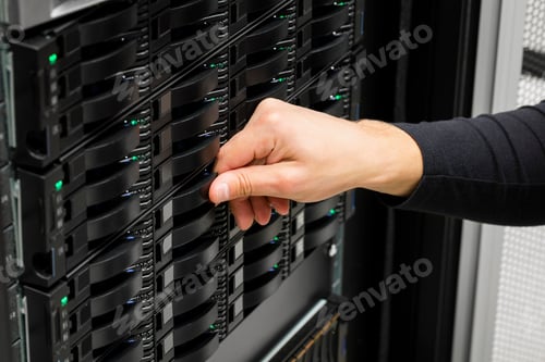 Preview: IT Engineer's Hand Replacing Hard Drive In Data Center