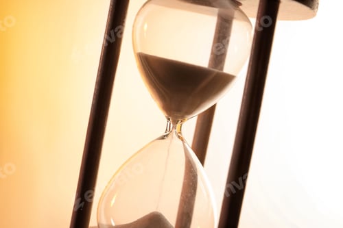 Preview: Hourglass with flowing sand on light background. Time management