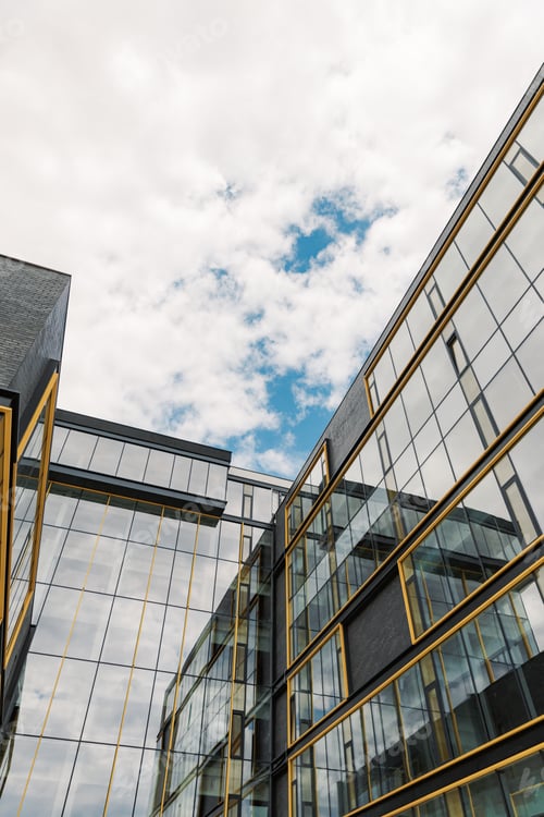 Preview: New construction office building with blue sky in the background.