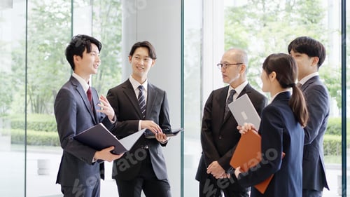 Preview: Business people talking in the lobby