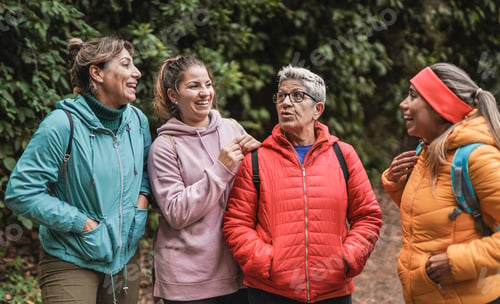 Preview: Multi generational women enjoy trekking day in nature
