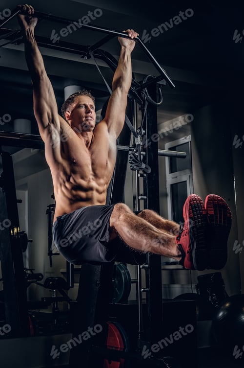 Preview: A man doing ABS workouts on pull up bar.