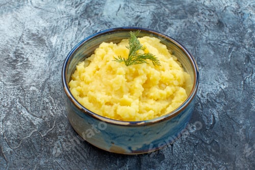 Preview: Side view of mashed potatoes served with dill on dark color background with free space