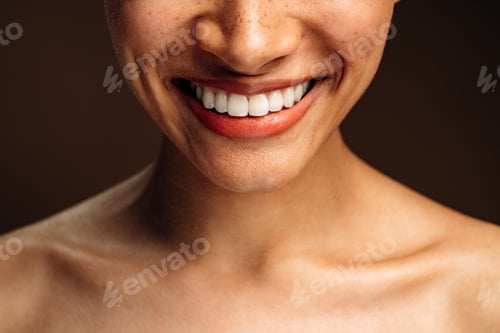 Preview: Cropped view of the multiracial woman smiling toothy and posing to the camera