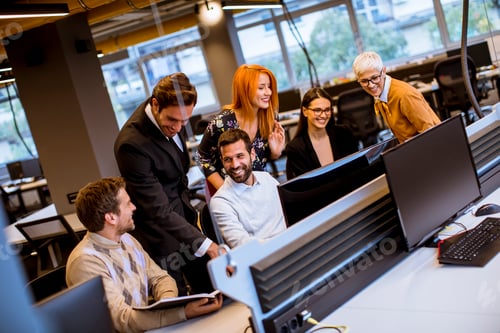 Preview: Senior businesswoman and young business people work in a modern office