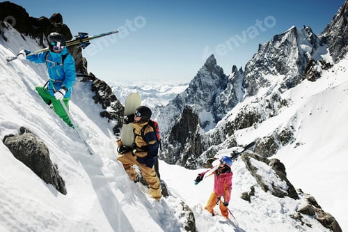 Preview: Group of skiers climbing steep mountain