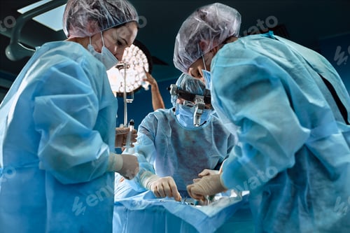 Preview: Surgical team in the operating room, close-up. An international team of professional doctors in a