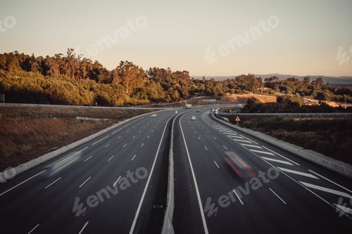 Preview: Long exposure shot of a highway with cars movement at sunset