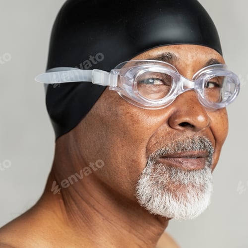 Preview: Senior African American swimmer wearing a swim cap and goggles