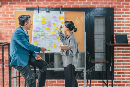 Preview: Professional Colleagues Brainstorming Ideas in a Modern Collaborative Workspace