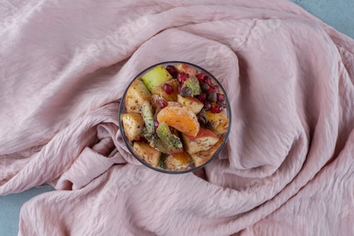 Preview: Fruit salad in a glass cup with chopped foods