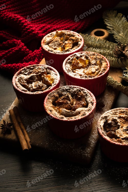 Preview: Traditional Christmas cupcakes on a black background.