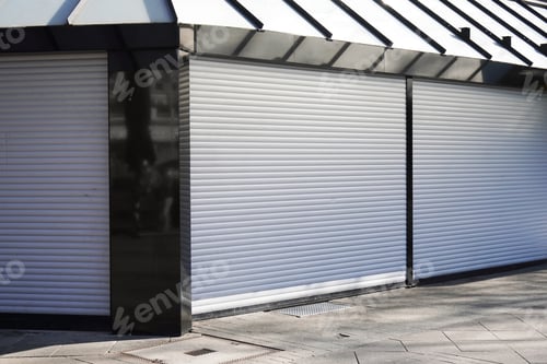 Preview: closed business shop or store front with roller shutters. economy crisis and recession concept.