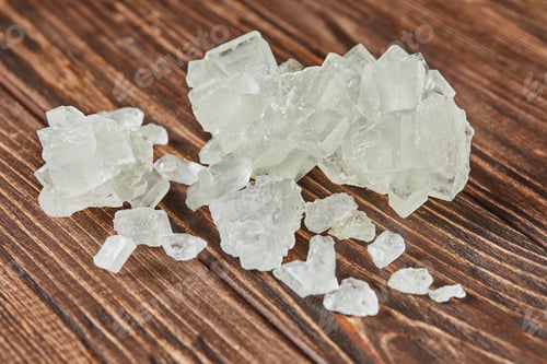 Preview: Crystalline sugar lying on vintage wooden background
