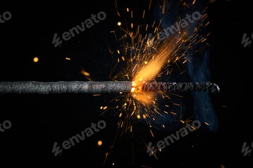 Preview: Close up burning sparkler isolated on black background