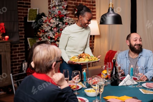 Preview: Happy people at seasonal dinner