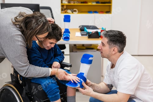 Preview: Parents helping child with leg brace fitting