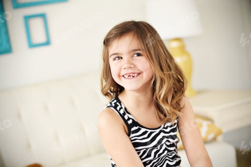 Preview: Little girl smiling with uncertainty