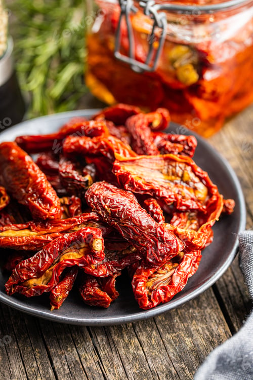 Preview: Sun dried tomatoes on plate.