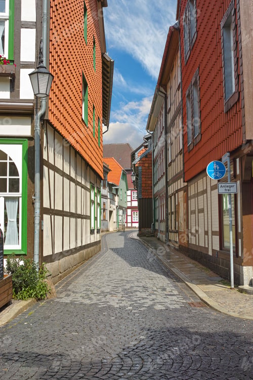 Preview: Road, brick or path by houses for architecture, buildings or travel or exploration in Germany. Outd