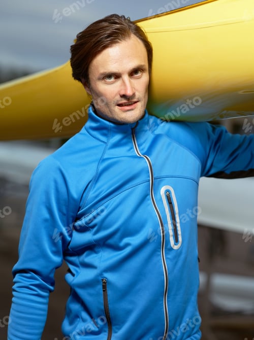 Preview: Portrait of athletic man with boat