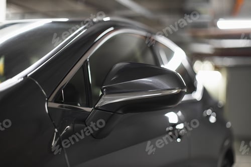 Preview: Rear view mirror of parked car in underground garage