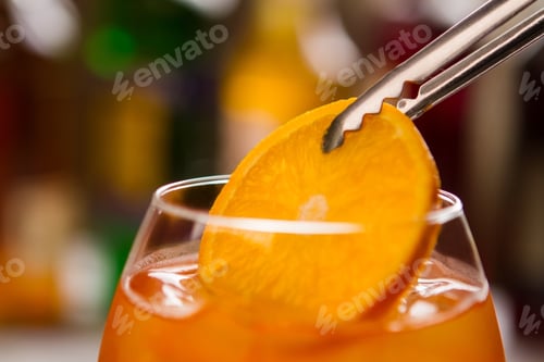 Preview: Tongs hold orange slice