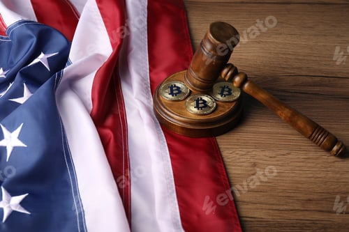 Preview: Cryptocurrency. Bitcoins, judge's gavel and American flag on wooden table, closeup