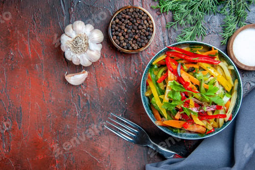 Preview: top view vegetable salad in bowl ultramarine blue shawl garlic black pepper fork on dark red table