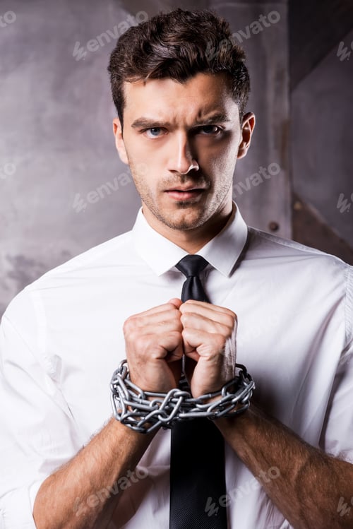 Preview: Help me! Frustrated young man in shirt and tie holding hands clasped while being trapped in